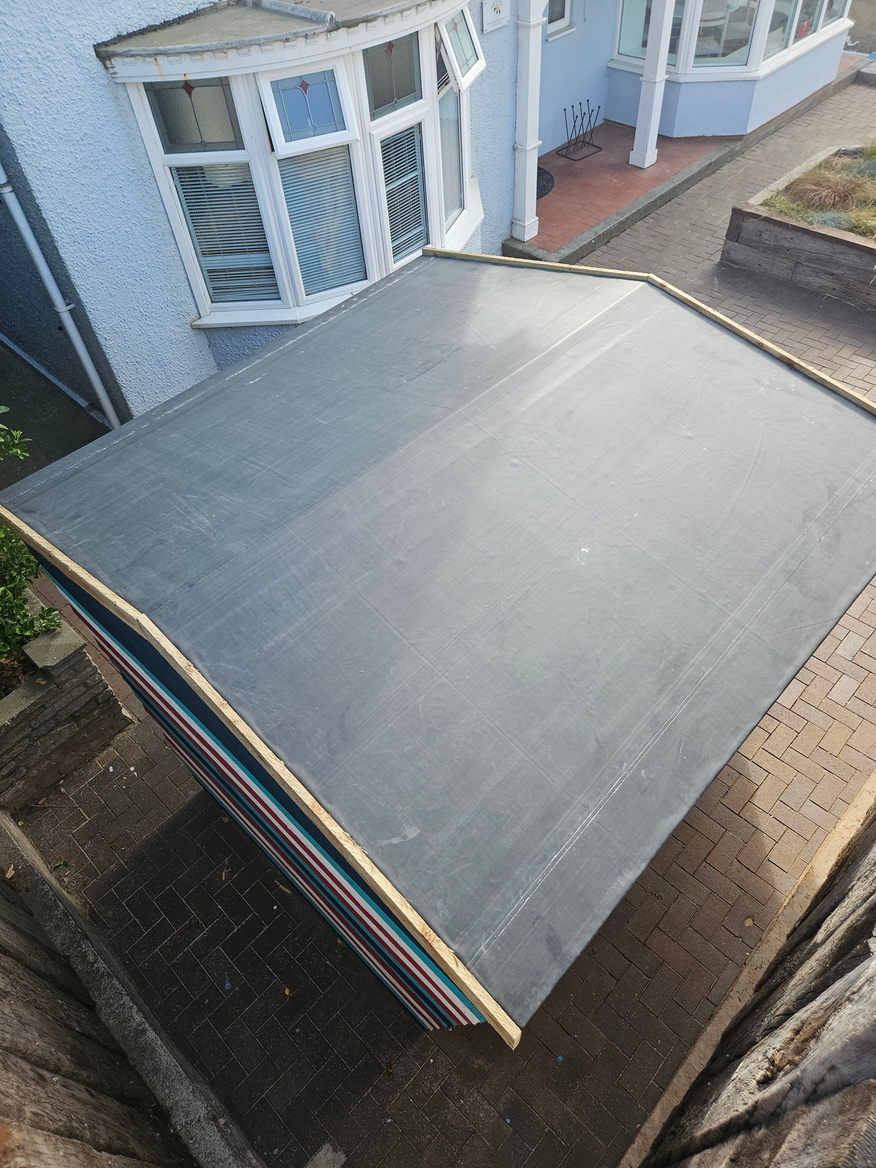 Completed EPDM flat roof on a small outbuilding in Anglesey
