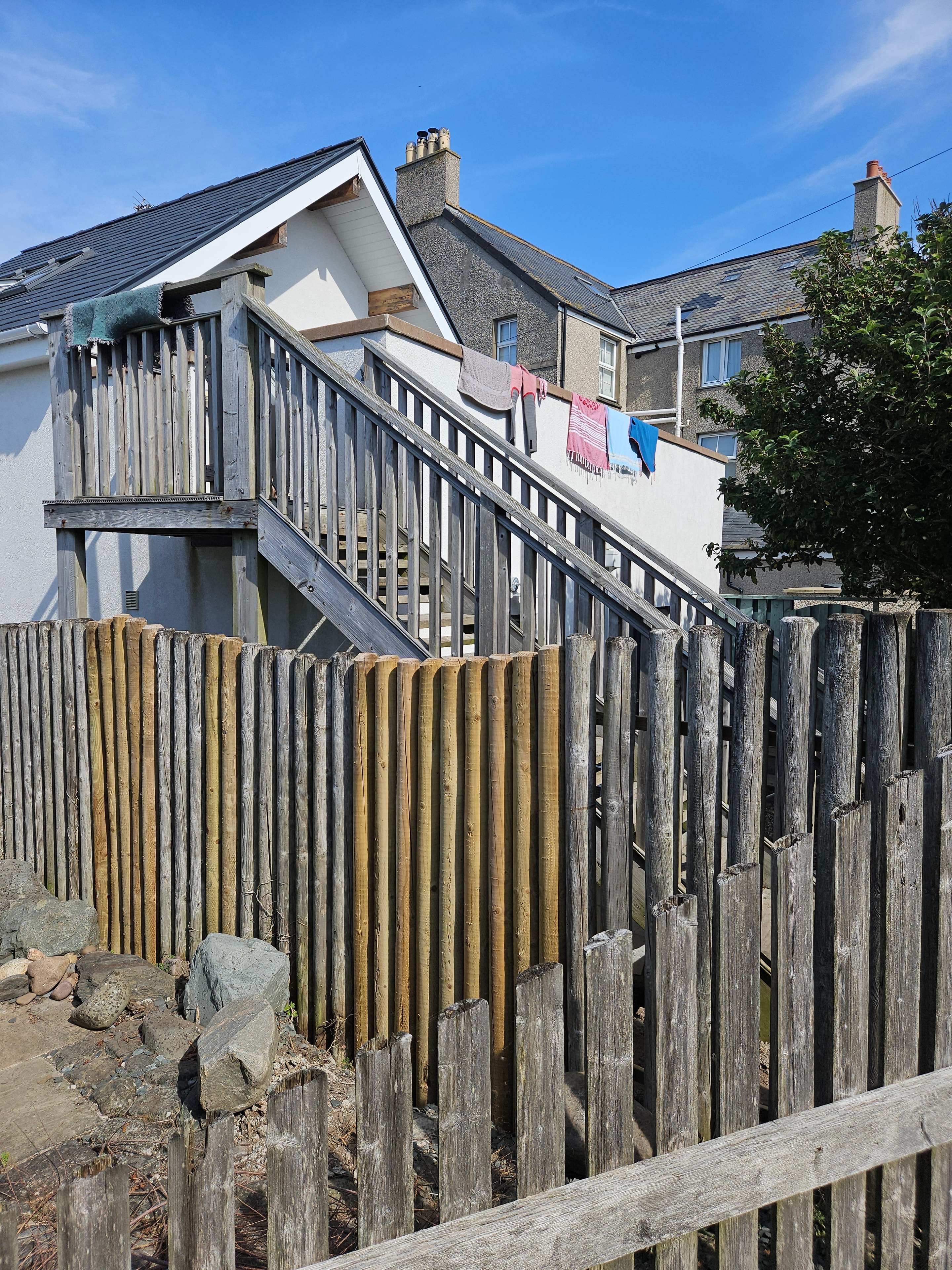 Replacement timber fence posts and supporting rails fitted during an Anglesey fence repair