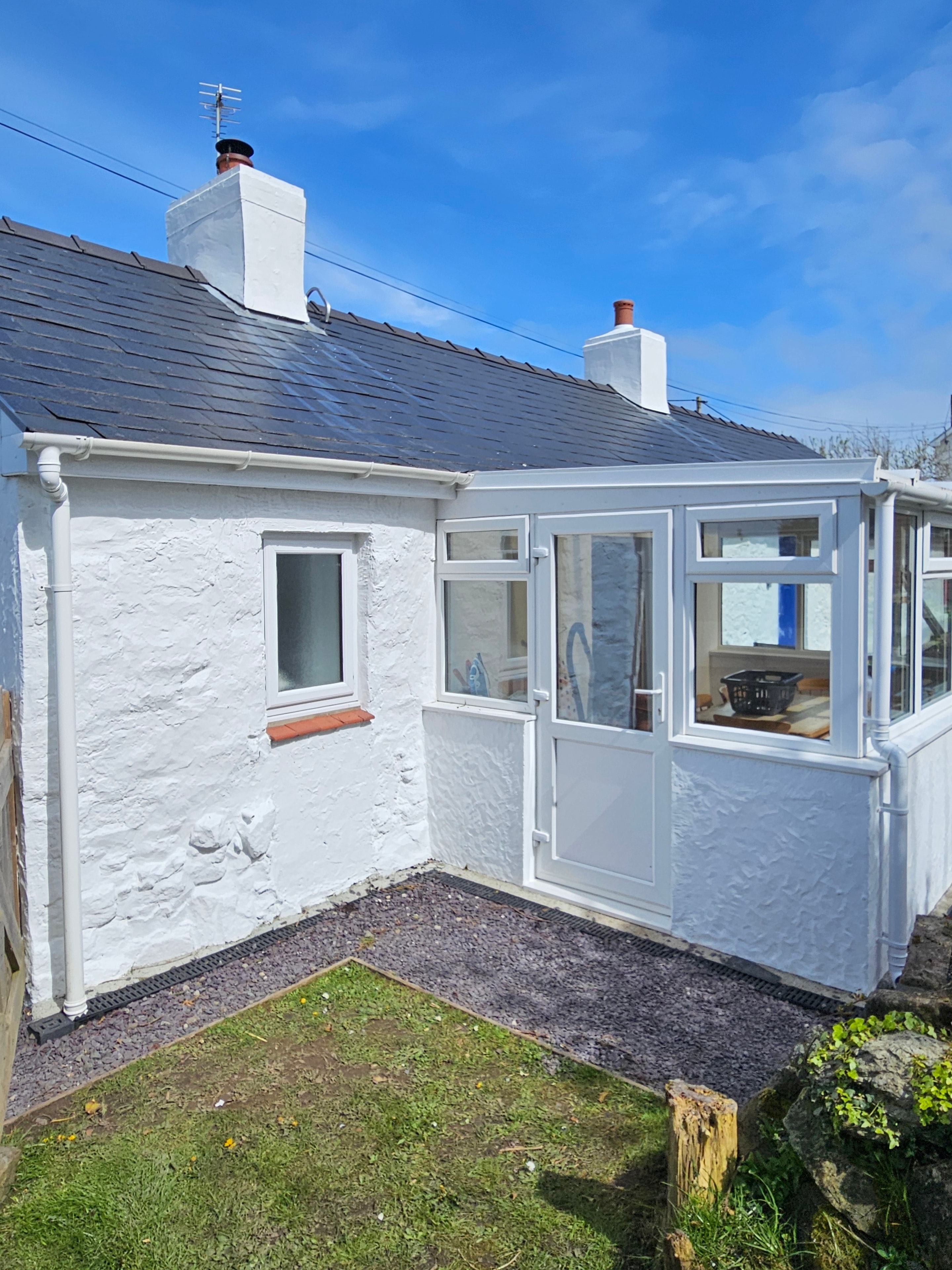 Repainted cottage exterior and chimney breasts in Hermon, Anglesey