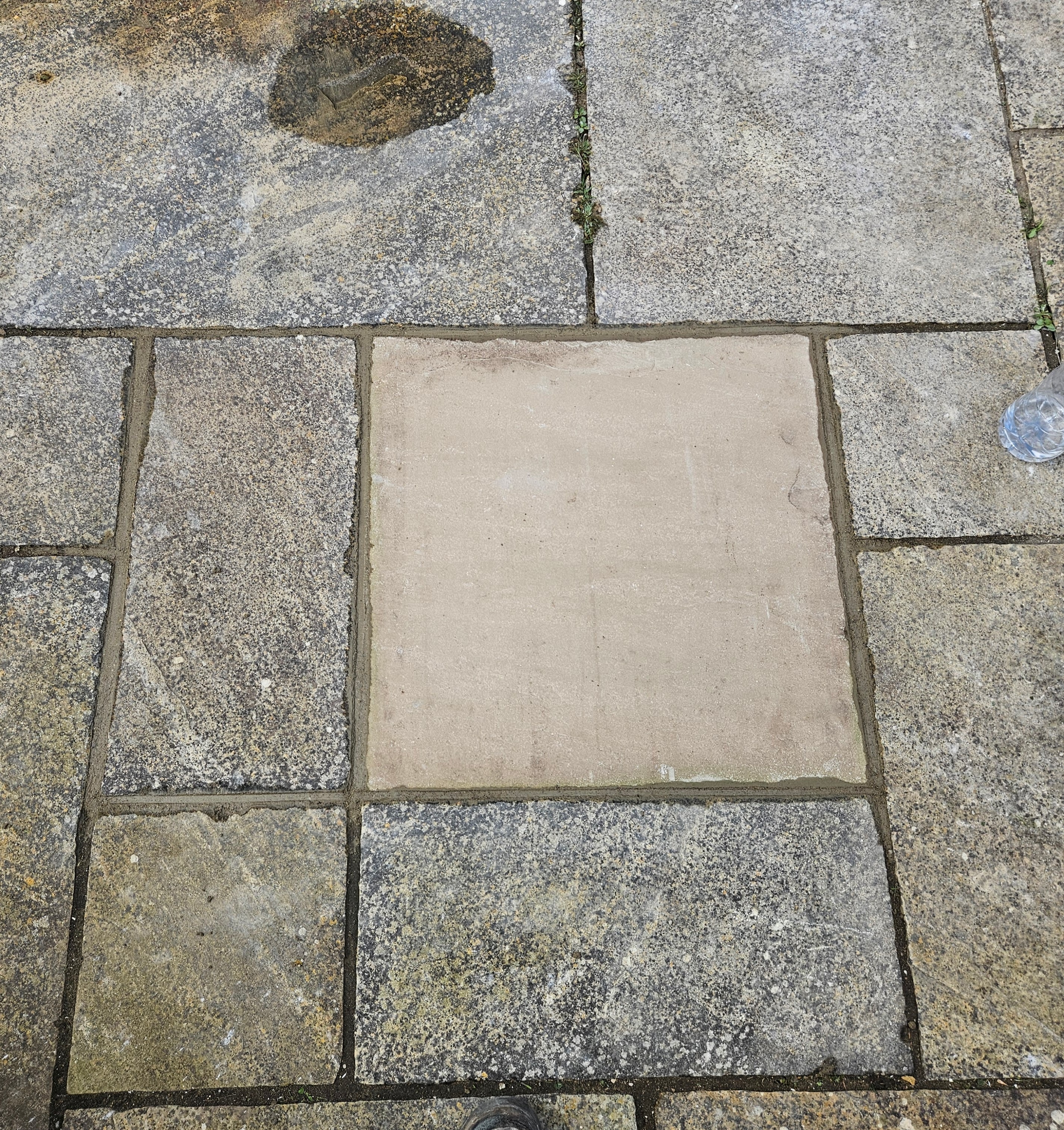 Completed patio repair — relaid and repointed paving